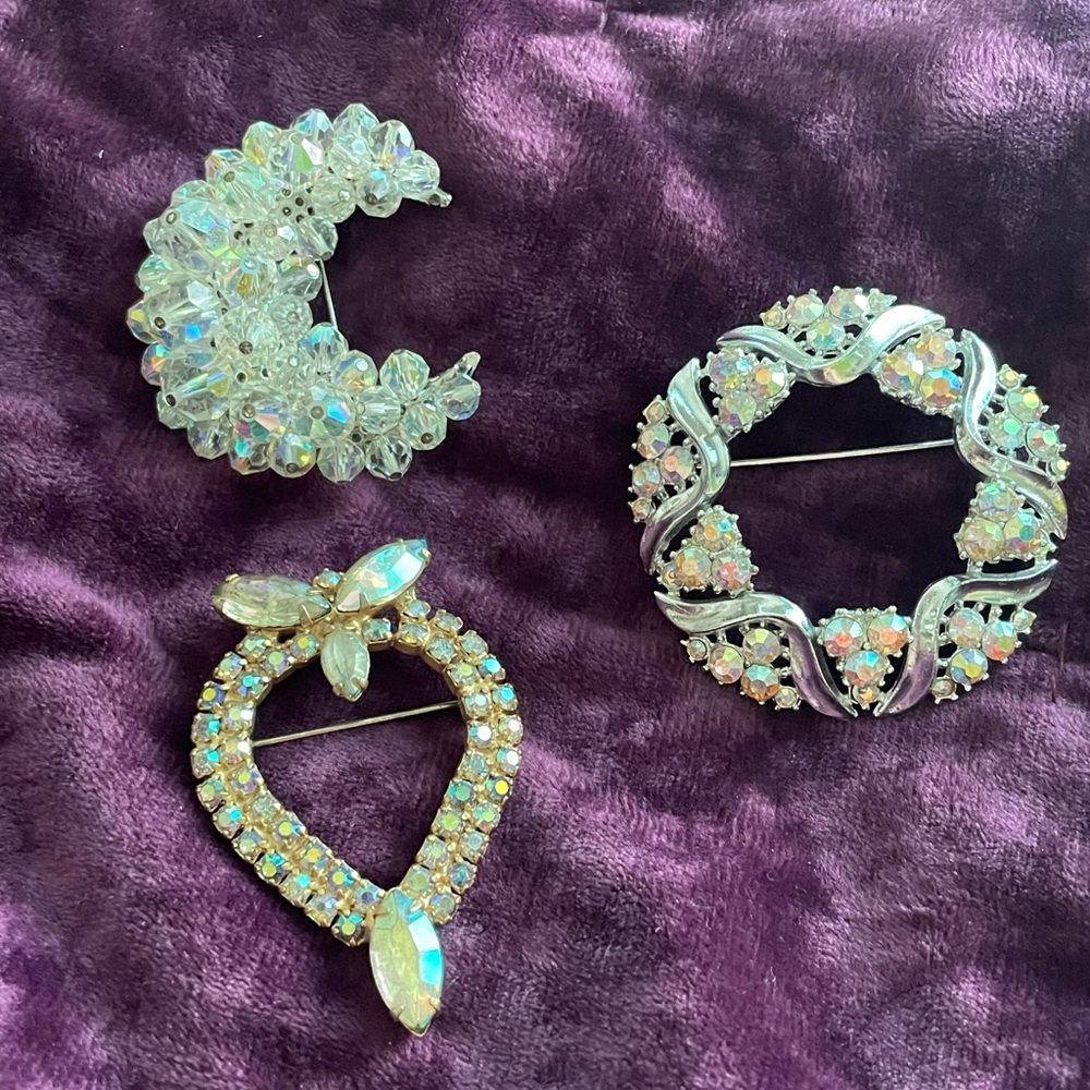 Three unmarked brooches